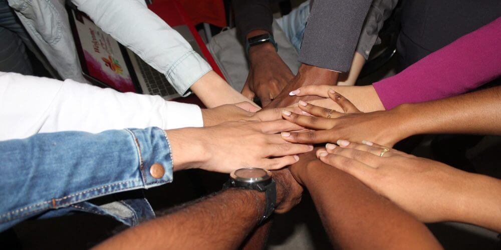 One for all, all for one - hands in a circle